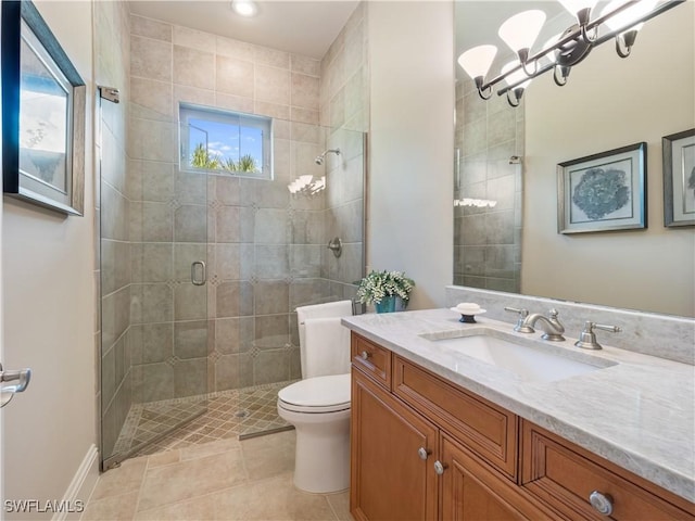 bathroom with tile patterned flooring, vanity, toilet, a shower with door, and an inviting chandelier