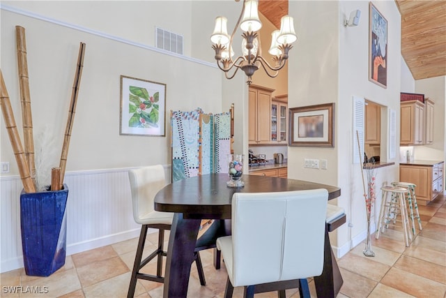 dining area featuring an inviting chandelier, high vaulted ceiling, wooden ceiling, and light tile patterned flooring