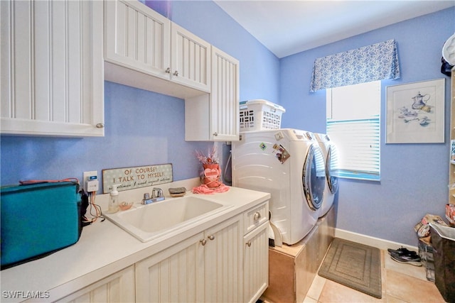 washroom with cabinets, light tile patterned flooring, sink, and independent washer and dryer