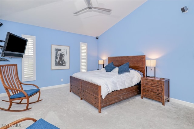 bedroom featuring ceiling fan, light colored carpet, and lofted ceiling