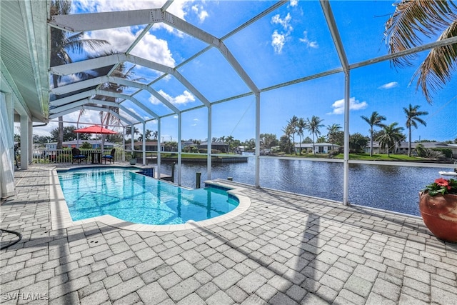 view of pool with a water view, a lanai, and a patio