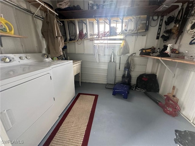 washroom featuring laundry area and washing machine and clothes dryer