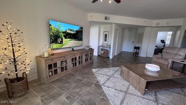 tiled living room featuring ceiling fan