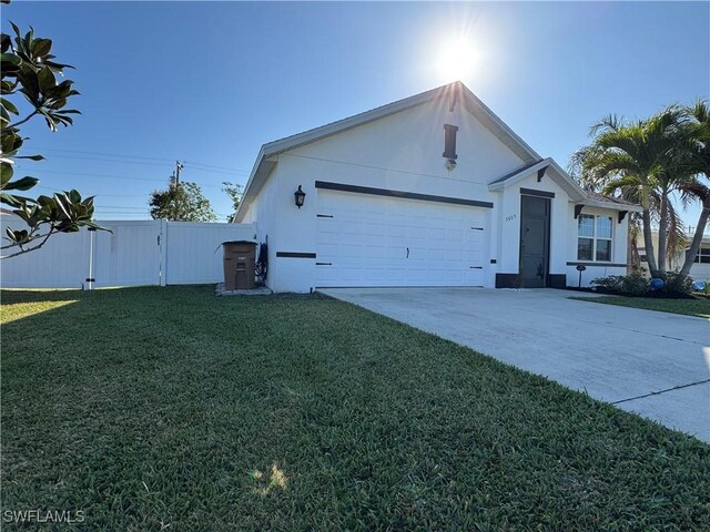 single story home featuring driveway, stucco siding, an attached garage, fence, and a front yard