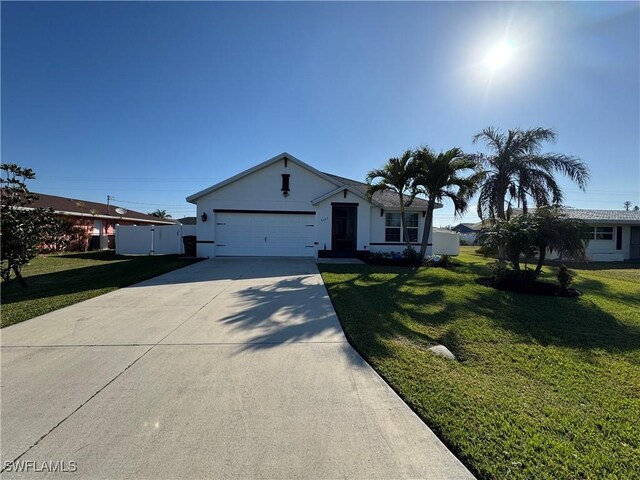 view of front of property featuring a garage, concrete driveway, a front lawn, and stucco siding