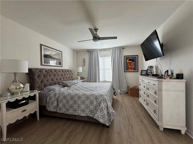 bedroom featuring wood finished floors and a ceiling fan