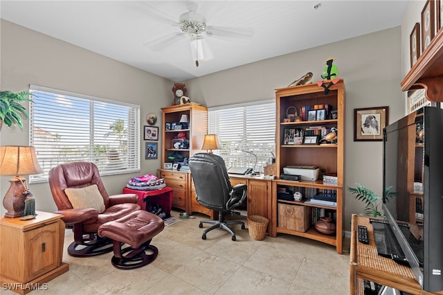 tiled office space featuring ceiling fan