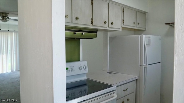 kitchen with ceiling fan, carpet flooring, and white appliances