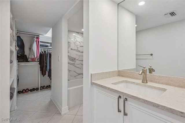 bathroom featuring tile patterned floors and vanity