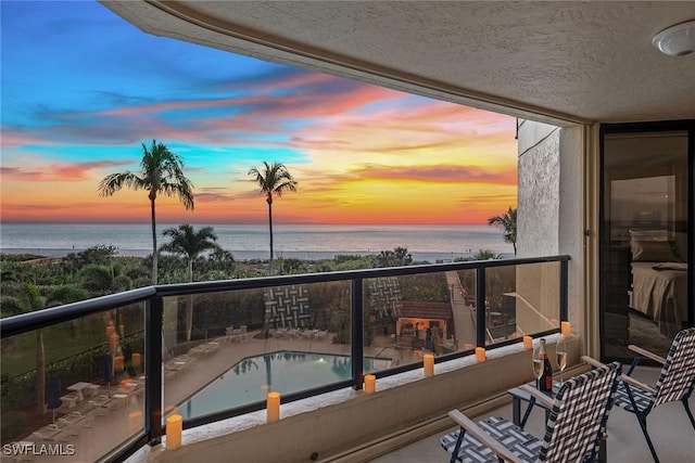 balcony at dusk with a water view