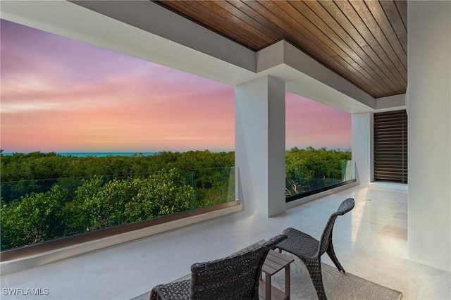 view of balcony at dusk