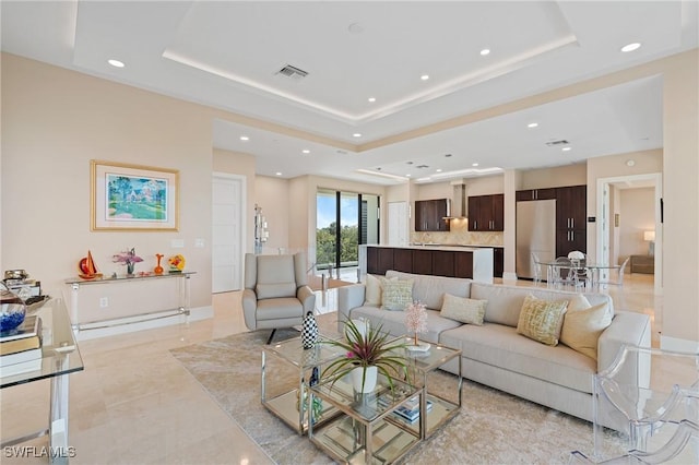 living room with a tray ceiling