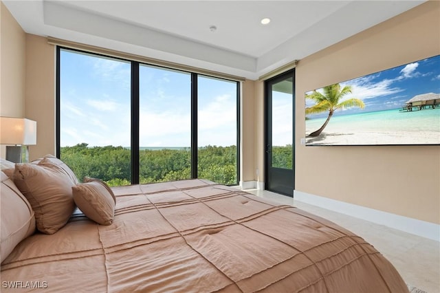 bedroom with a water view and a beach view