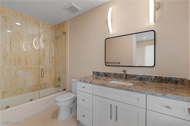 full bathroom with vanity, shower / bath combination with glass door, and toilet