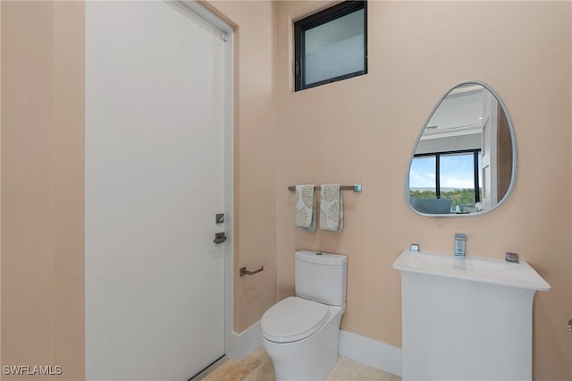 bathroom featuring toilet