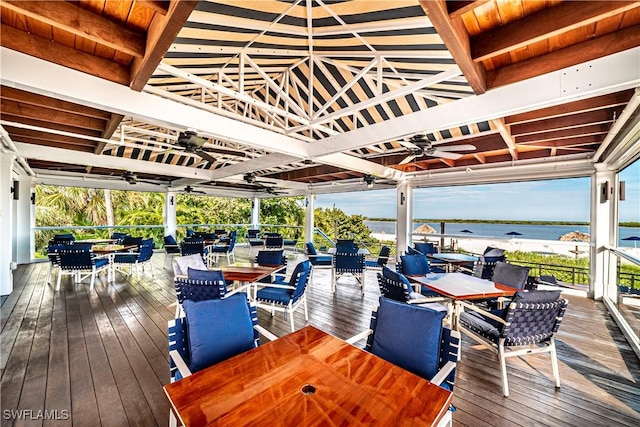 deck featuring a water view and ceiling fan