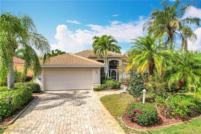 mediterranean / spanish-style house featuring a garage