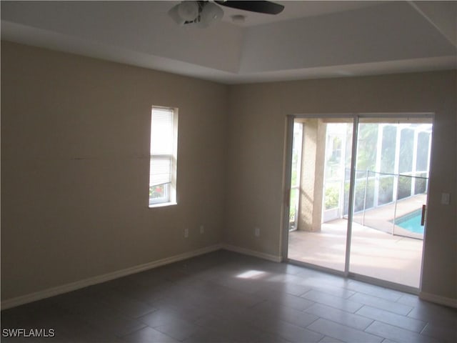 unfurnished room with plenty of natural light and ceiling fan