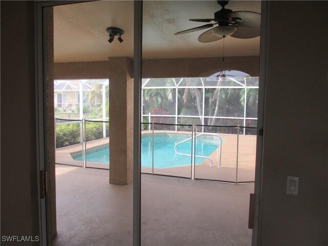 view of pool featuring ceiling fan