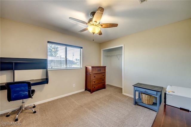 office area featuring ceiling fan and light colored carpet