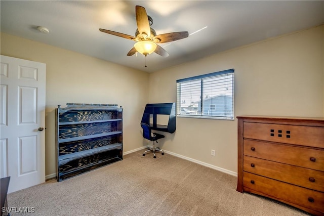 carpeted office space with ceiling fan