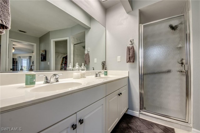 bathroom with vanity and walk in shower