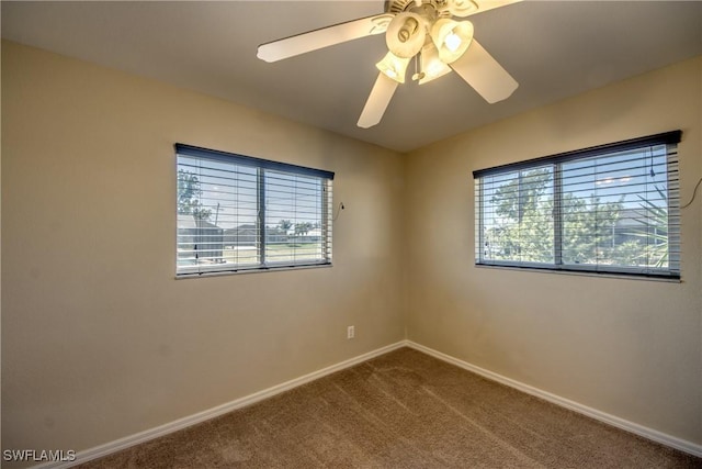 carpeted empty room with ceiling fan