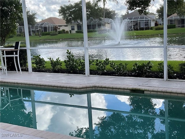 view of pool with a water view