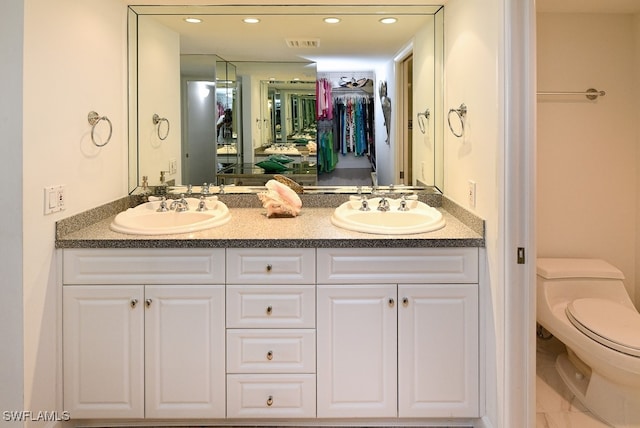 bathroom with vanity and toilet