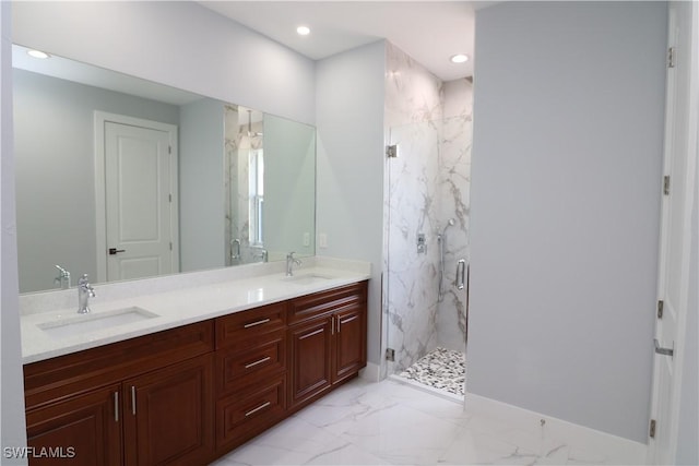 bathroom with walk in shower and vanity