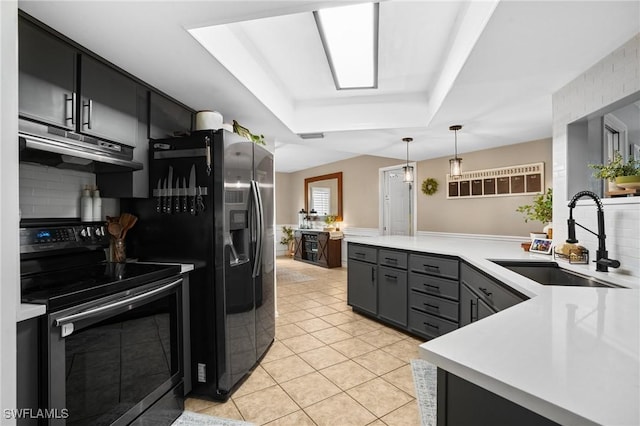 5060 Melaluca Dr, Fort Myers, FL 33905 - kitchen with range with electric stovetop, ventilation hood, a raised ceiling, and light countertops