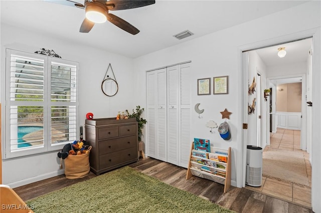 5060 Melaluca Dr, Fort Myers, FL 33905 - bedroom featuring multiple windows, wood finished floors, a closet, and a ceiling fan