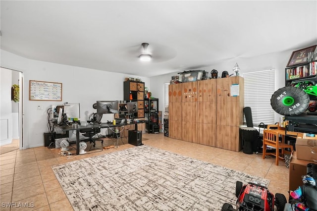 office area featuring a ceiling fan and tile patterned floors