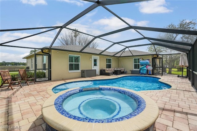 view of pool with glass enclosure, a pool with connected hot tub, outdoor lounge area, and a patio