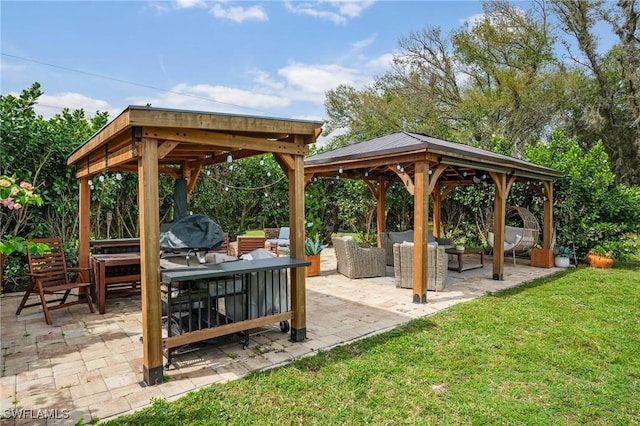 exterior space with outdoor dining space, grilling area, a gazebo, and an outdoor hangout area