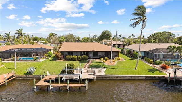 view of dock with boat lift, a water view, a lawn, a residential view, and a lanai