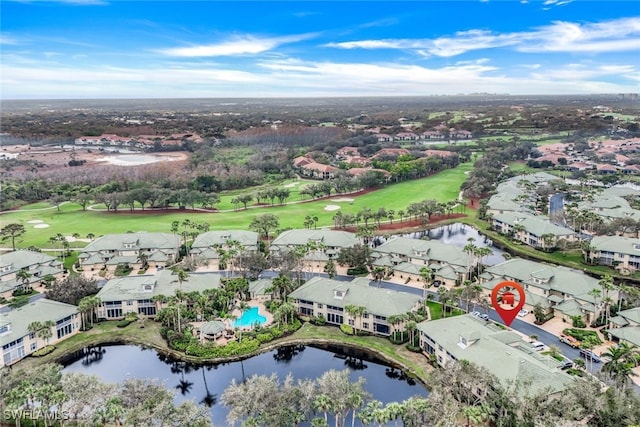 bird's eye view featuring a residential view, golf course view, and a water view