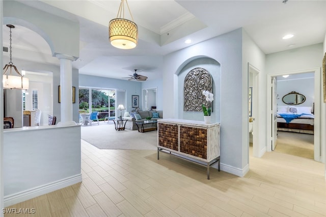 hallway featuring recessed lighting, decorative columns, light wood-style floors, and baseboards