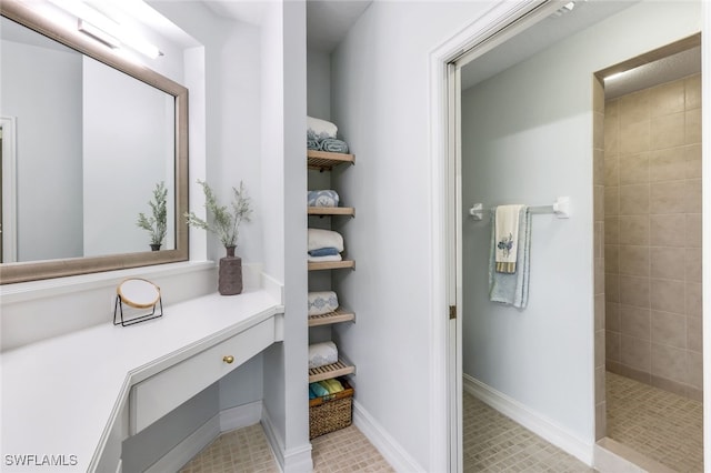 full bathroom with baseboards and walk in shower