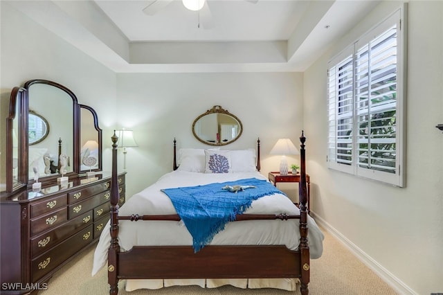 carpeted bedroom with baseboards and ceiling fan