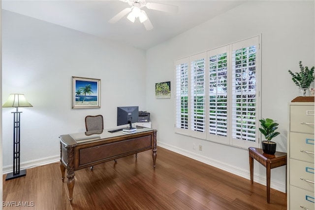 office area featuring wood finished floors, baseboards, and ceiling fan