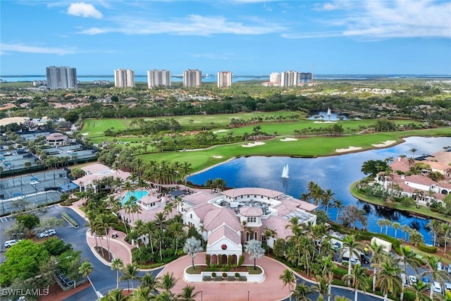 aerial view featuring view of golf course and a water view