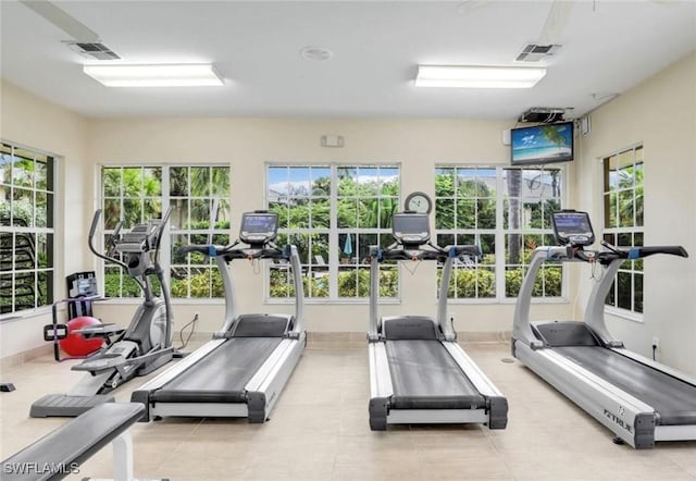 gym featuring a wealth of natural light and visible vents