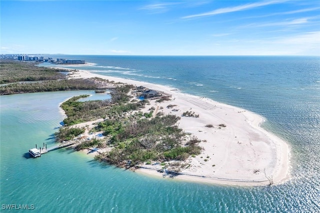 drone / aerial view with a beach view and a water view