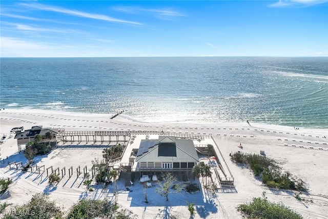 bird's eye view featuring a beach view and a water view