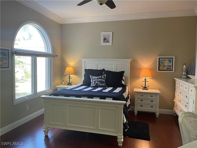 bedroom with dark wood-style floors, multiple windows, and baseboards