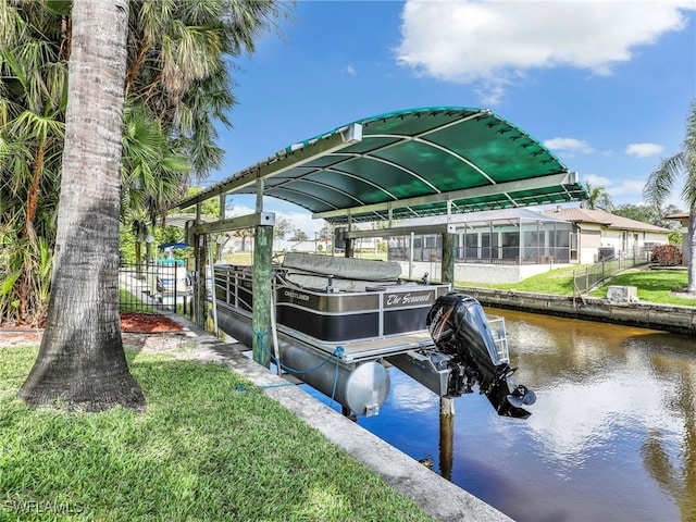 dock area with a water view and boat lift