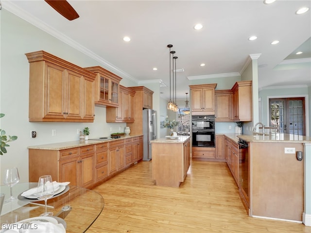 kitchen with dobule oven black, a peninsula, high end refrigerator, a kitchen island, and glass insert cabinets