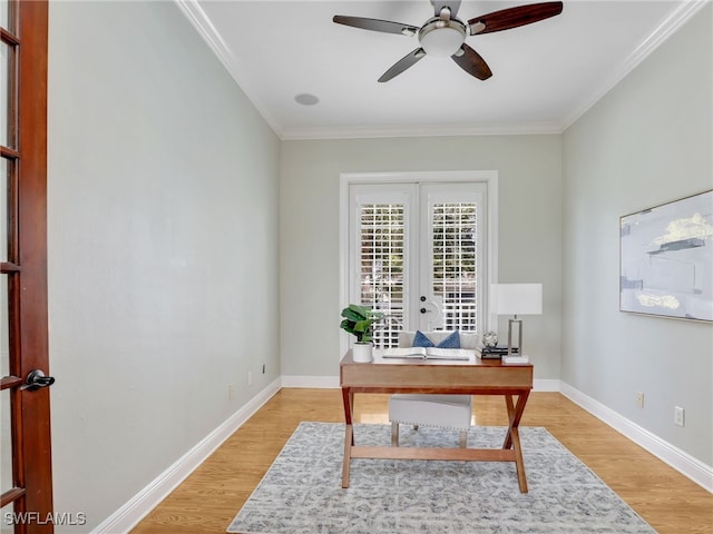 office featuring crown molding, french doors, baseboards, and light wood-style floors