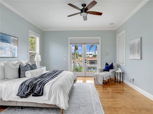 bedroom with crown molding, baseboards, wood finished floors, and access to exterior